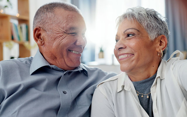 A couple smiling at each other